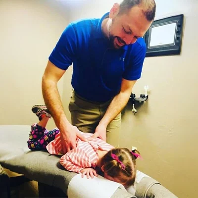 Chiropractor Edmond OK Devin Nightengale Adjusting Patient